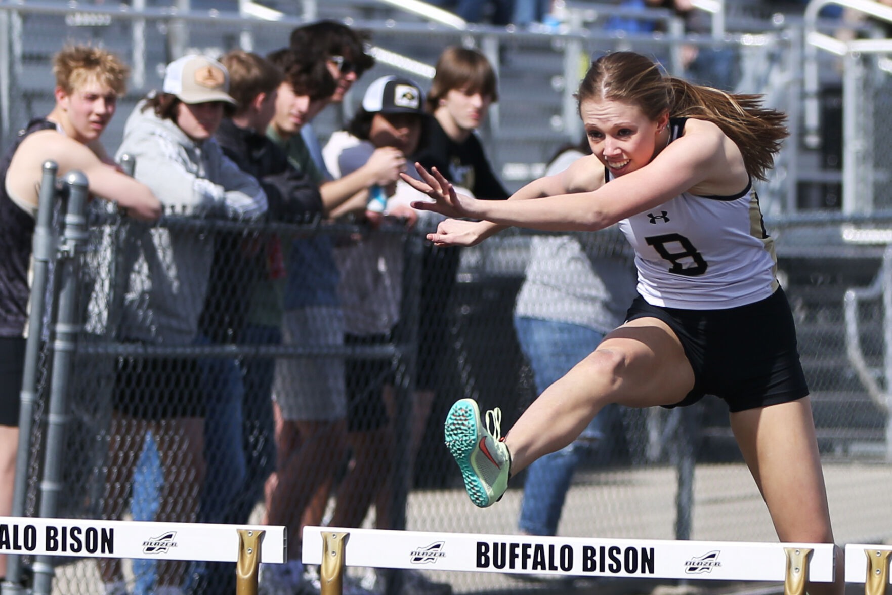Alaina Gross clears the final hurdle during the 300 meter hurdles